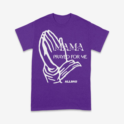 Purple t-shirt with white praying hands graphic and text on a white background