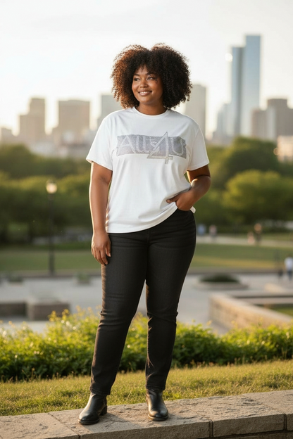Person wearing a white "Starlight" t-shirt with ALLS4U logo, standing outdoors with a cityscape in the background